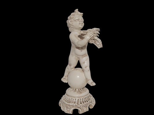 ANTICA STATUINA PUTTO CON SPIGHE SU GLOBO CERAMICA CAPODIMONTE N BLU CORONATA