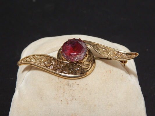 ANTICA SPILLA ART DECO CON DORATURA E CRISTALLO COLOR AMETISTA